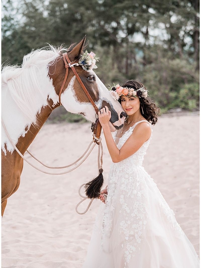 a person standing next to a horse