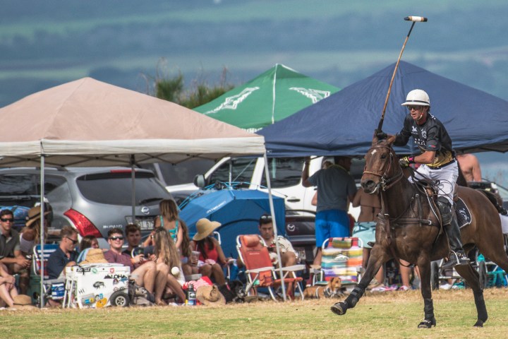a group of people riding on the back of a horse